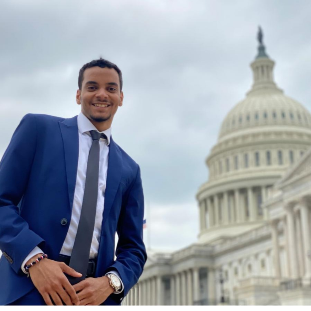 Andres Heredia-Belliard standing next to the Capitol Building 