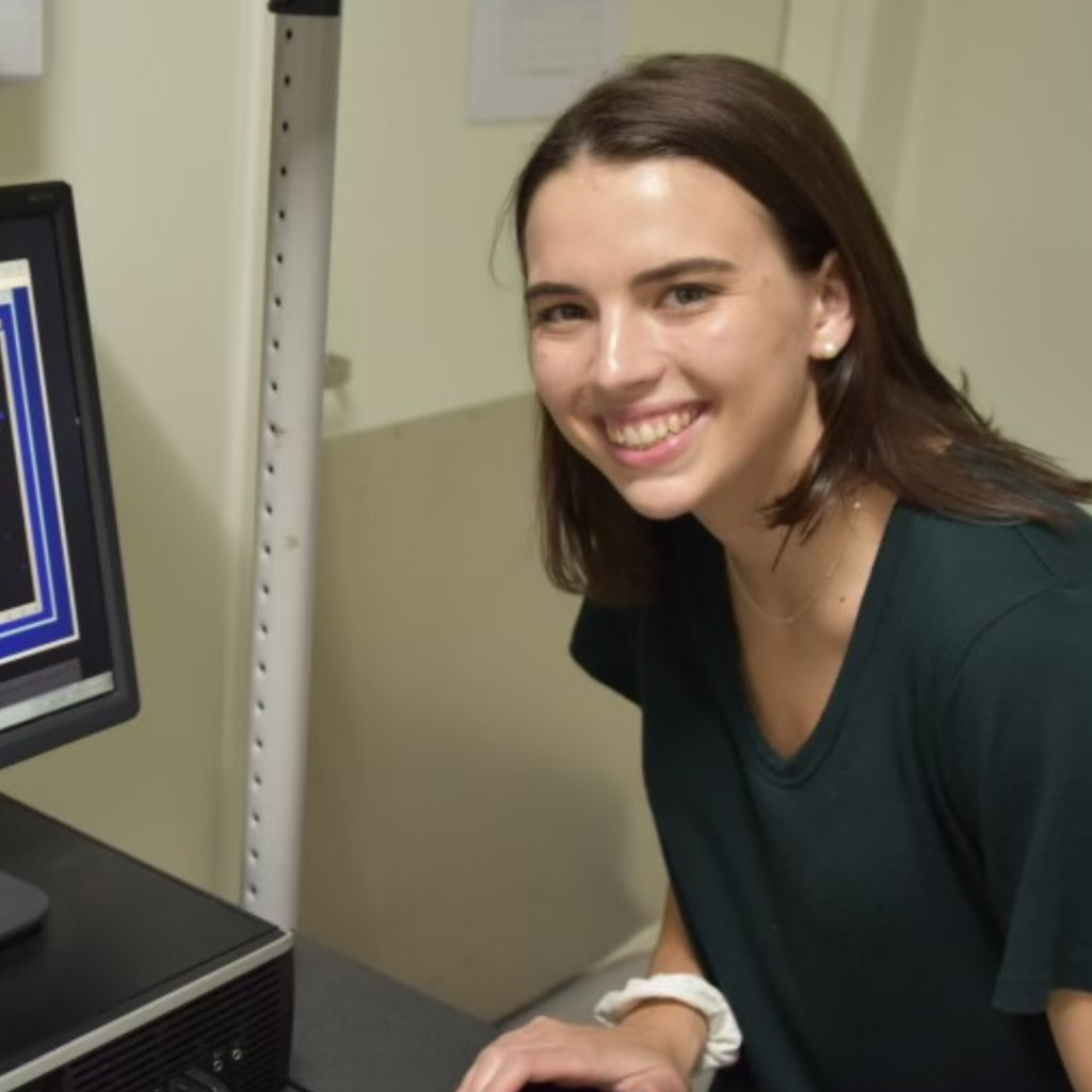 Shannon Maguire posing with a computer