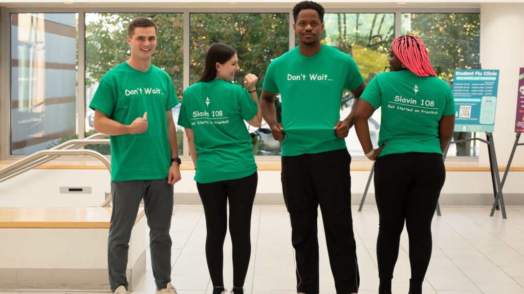Students wearing don't wait t-shirts